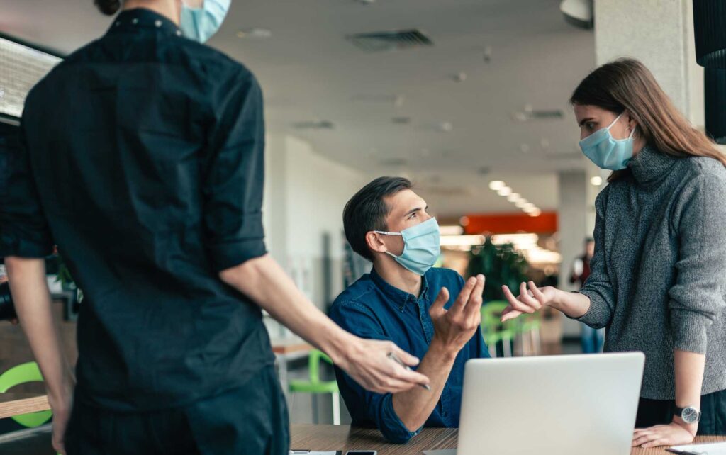 group masked in office